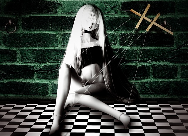Female puppet in chains